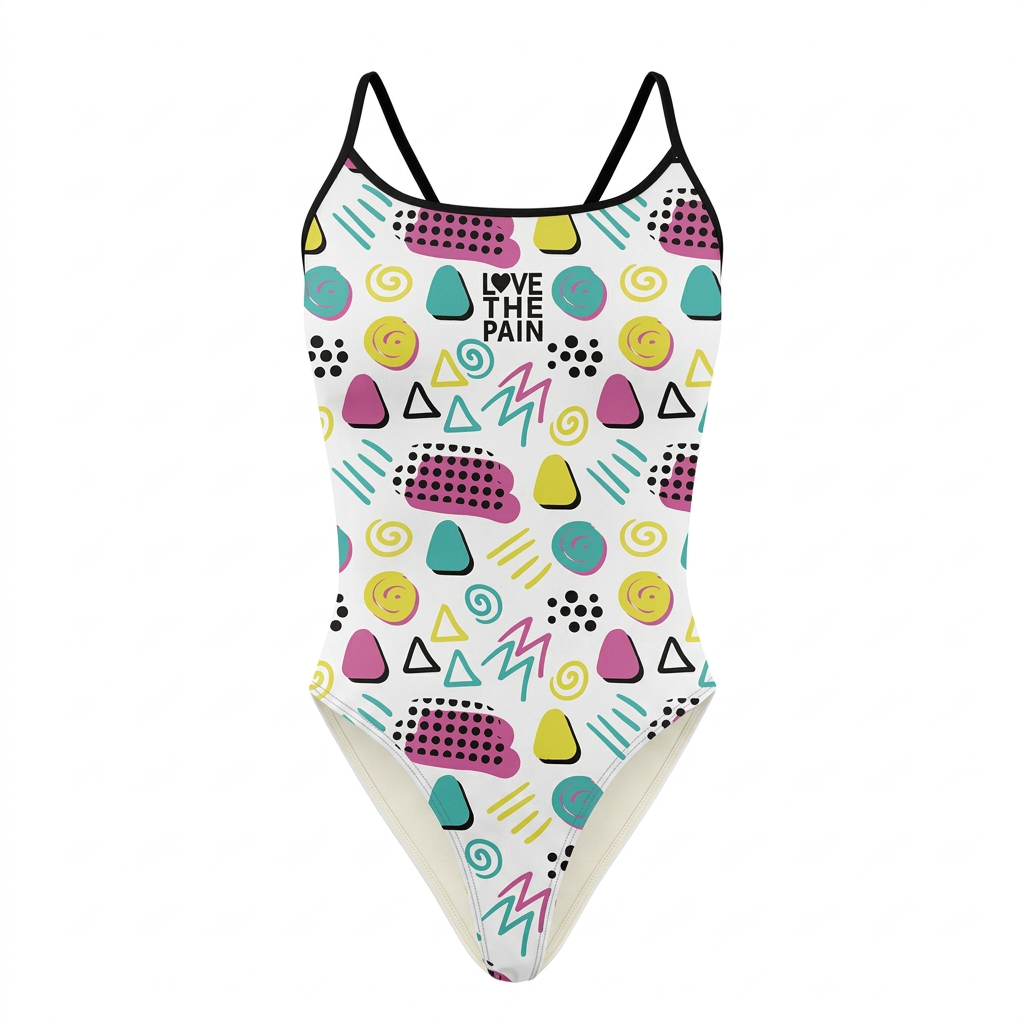 White one-piece swimsuit with teal pink yellow and black playful geometric shapes and single black straps on white