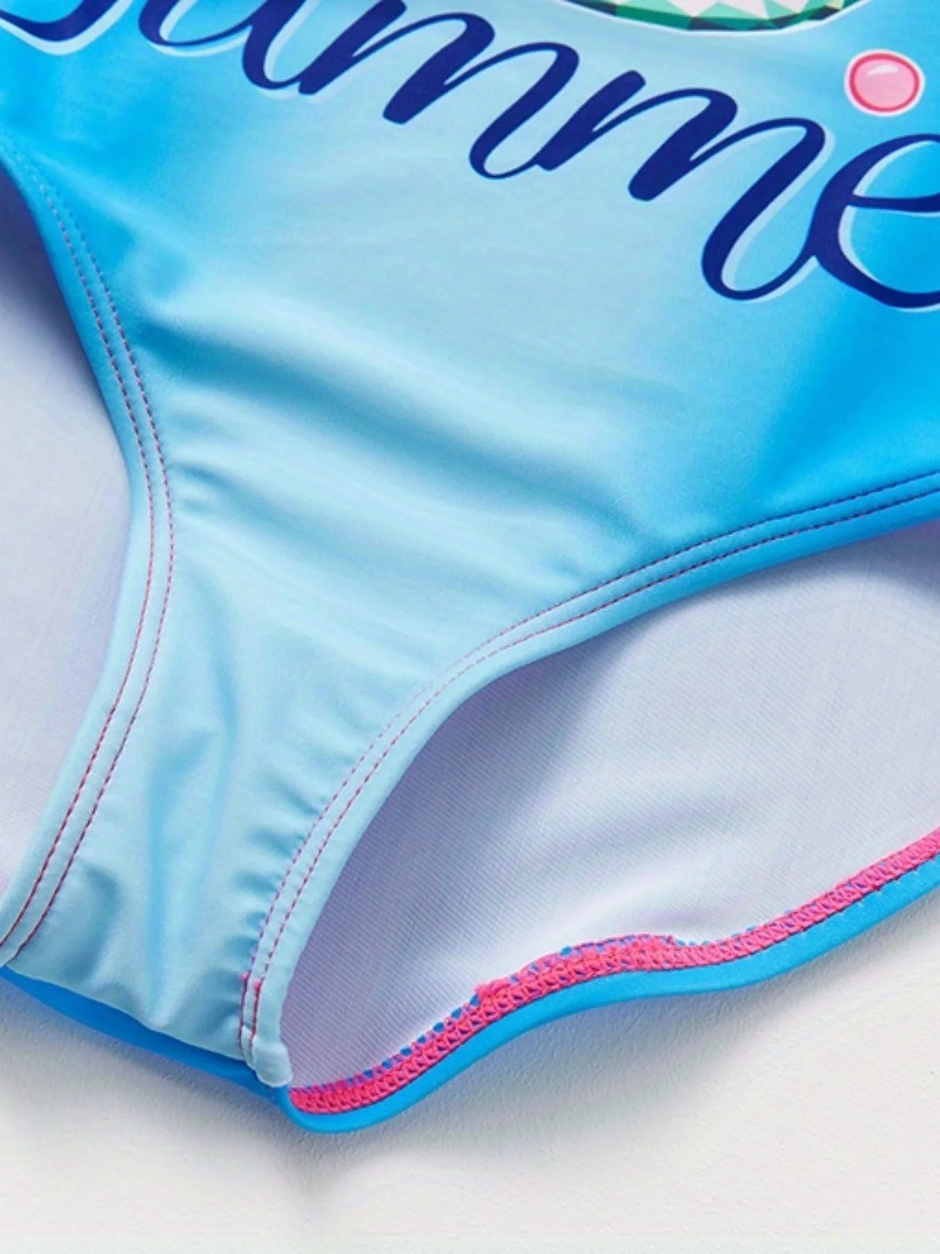 A girl's swimsuit with a fruit pattern, suitable for children aged 2-11. Chest Pad
