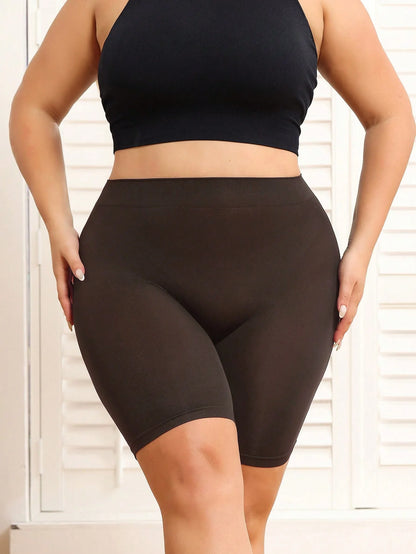 Plus-size women's shorts with tummy control and butt-lifting features to prevent exposure and provide safety shorts.