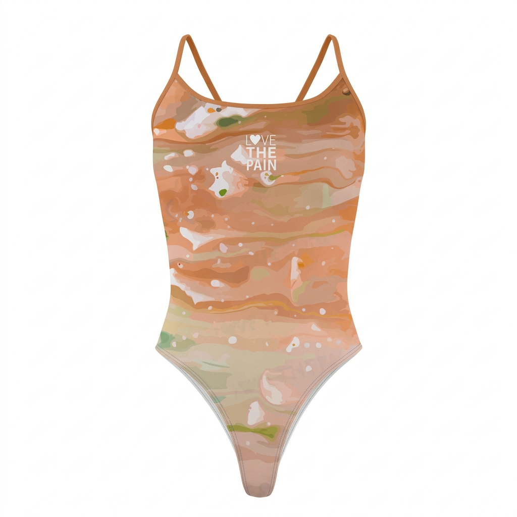 Peach green swimsuit with orange straps, studio view